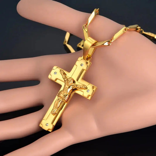 a gold bracelet with a cross on it
