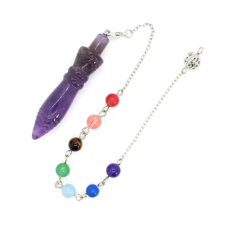 Healing Crystal Pendulum with 7 Chakra Stones - This image illustrates the healing crystal pendulum used in a tranquil meditation environment.