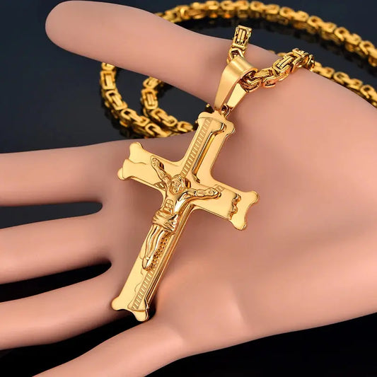 a gold bracelet with a cross on it