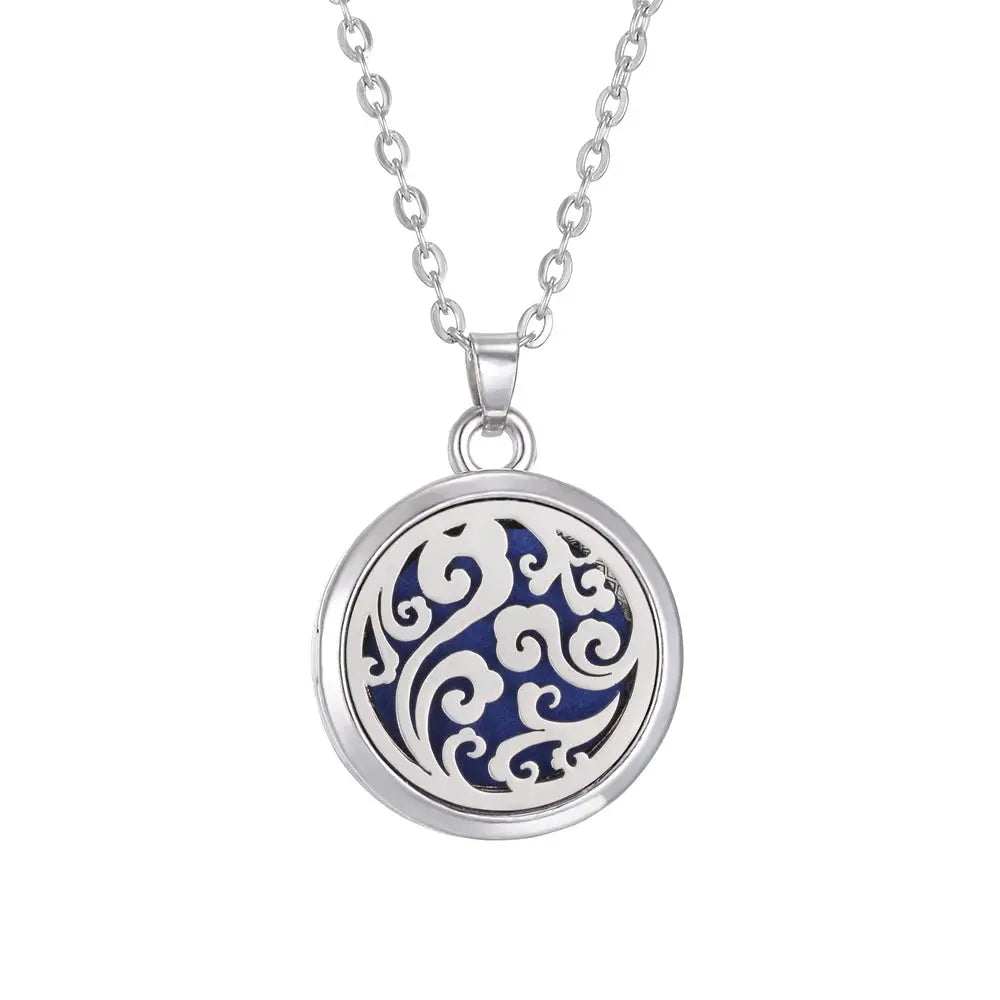 Stylish presentation of the Tree of Life Aromatherapy Necklace's stainless steel locket as an essential oil diffuser - stainless steel aroma necklace