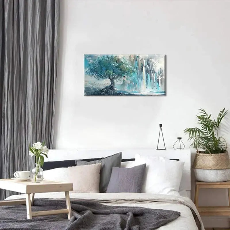 Elegant turquoise mountain wall art in a cozy bedroom setting, showcasing a tree against a serene backdrop.