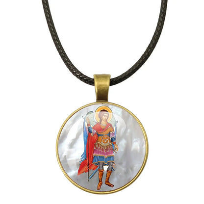 An inspiring image of the St. Michael Archangel Protection Necklace - Divine Shield Pendant with a prayer card.
