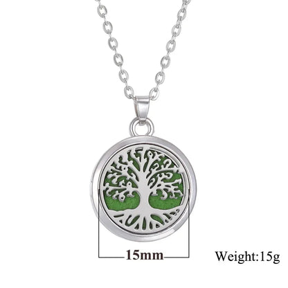 Essential oils being added to the Tree of Life Aromatherapy Necklace, perfect for personal scent - stainless steel aroma necklace