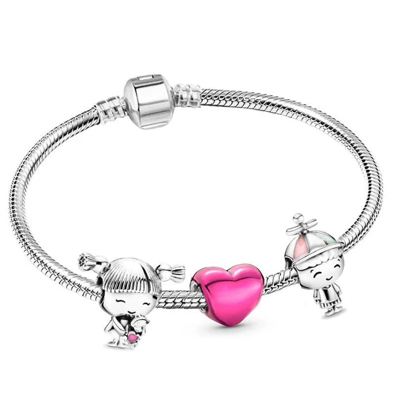 a pink heart charm bracelet with two charms