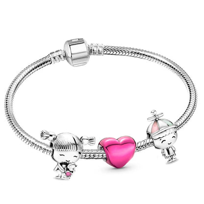 a pink heart charm bracelet with two charms