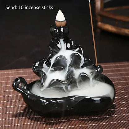 a black and white vase sitting on top of a table