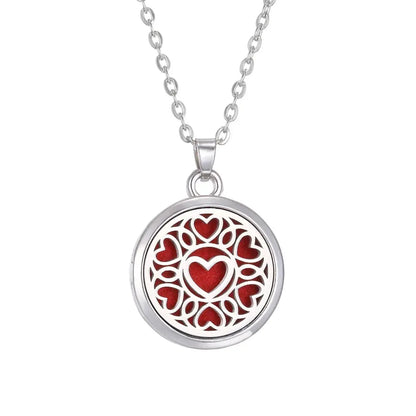 The elegant round locket of the Tree of Life stainless steel aroma necklace opened to show its use for essential oils - Tree of Life Aromatherapy Necklace