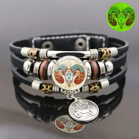 a close up of a bracelet with a coin on it