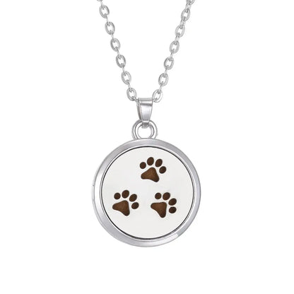 Stylish close-up of the pendant of the Tree of Life aromatherapy necklace, designed for essential oil diffusion - stainless steel aroma necklace