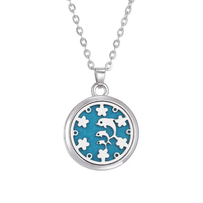 Capture of the Tree of Life stainless steel aroma necklace in natural light, accentuating its elegance - Tree of Life Aromatherapy Necklace